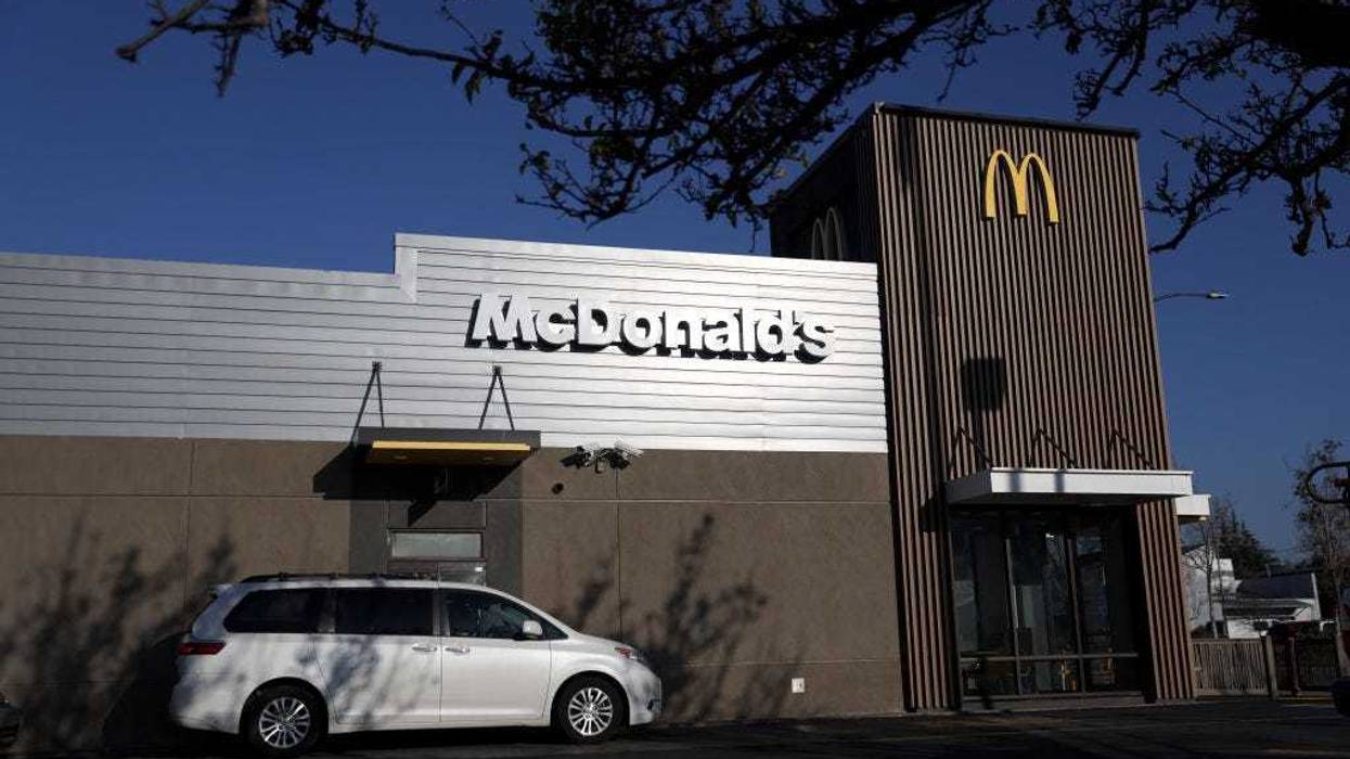 A car sits in the drive-thru at a McDonald's restaurant on January 27, 2022 in El Cerrito, California. McDonald's reported fourth quarter earnings that fell short of analyst expectations with revenues of $6.01 billion compared to expectations of $6.03 billion. (Photo by Justin Sullivan/Getty Images)