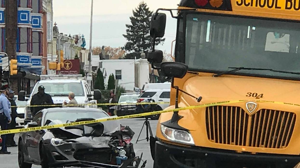 A car slammed into the back end of a parked school bus in West Philadelphia.
