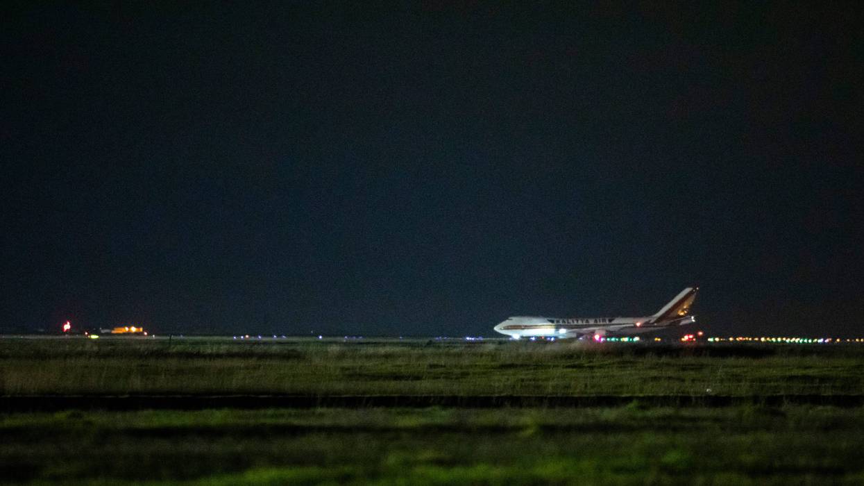 A cargo aircraft chartered by the U.S. government arrives from Japan carrying American citizens being evacuated from the quarantined Diamond Princess cruise ship, at Travis Air Force Base on February 16, 2020.