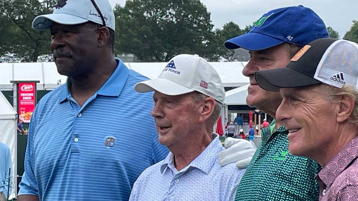 A celebrity group in the Travelers Championship Pro-Am (L-R): Pro Football Hall of Fame member Andre Tippett, PGA Tour legend Larry Nelson, ESPN's Chris Berman and famed quarterback Doug Flutie