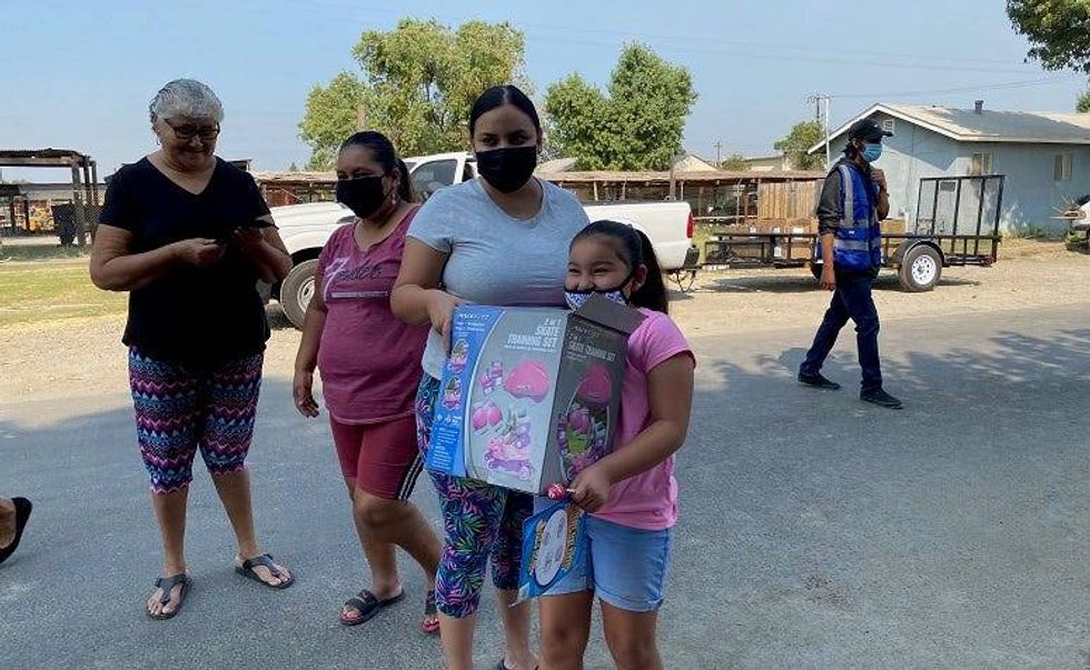 A Central Valley family picks up necessary supplies and other donations during the coronavirus pandemic