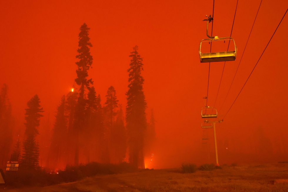A chairlift at Sierra-at Tahoe ski resort sits idle as the Caldor Fire moves through the area on August 30, 2021 in Twin Bridges, California.