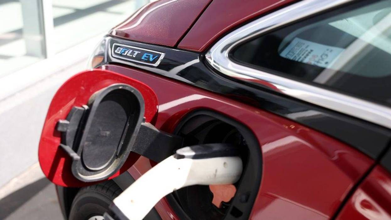 A Chevrolet Bolt EV sits parked at a charging station at Stewart Chevrolet on April 25, 2023 in Colma, California. Chevrolet announced plans to phase out production of its Chevrolet Bolt electric vehicles as the company paves the way for a new generation of electric vehicles. (Photo by Justin Sullivan/Getty Images)
