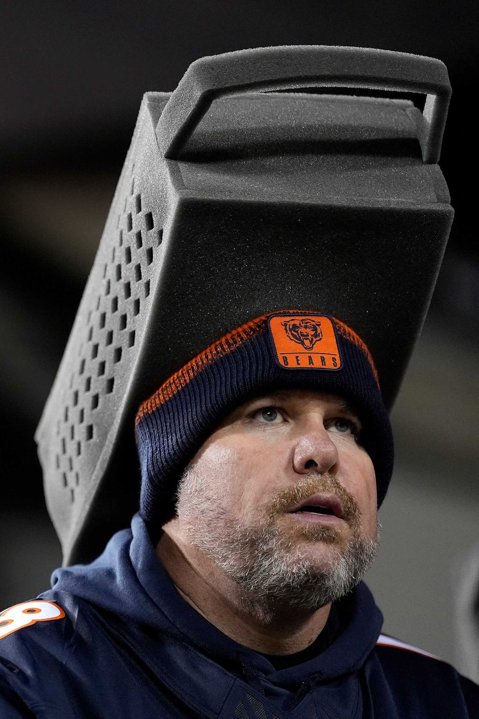 A Chicago Bears fan wears a cheese grater hat before the NFC Wild Card Playoff game against the Green Bay Packers at Soldier Field on January 10, 2026 in Chicago, Illinois.