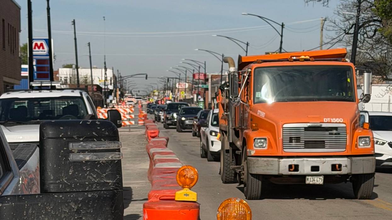 A Chicago Department of Transportation truck makes its way along a construction zone on Chicago Avenue in the city's Austin neighborhood.