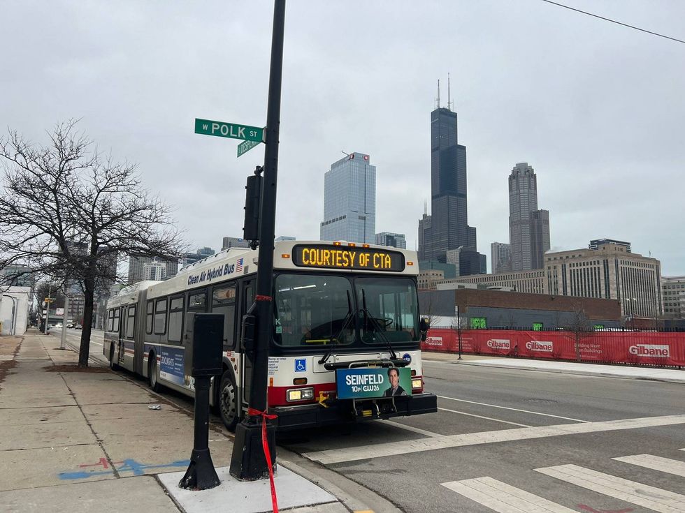 A Chicago Transit Authority warming bus at the corner of Desplaines and Polk Streets, where the City has established a so-called "landing zone" for newly arrived migrants.