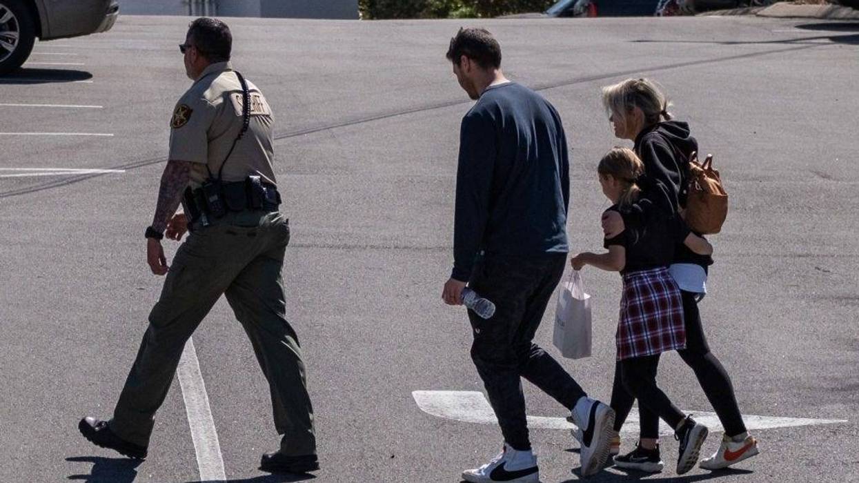 A child and parents after the school shooting in Nashville