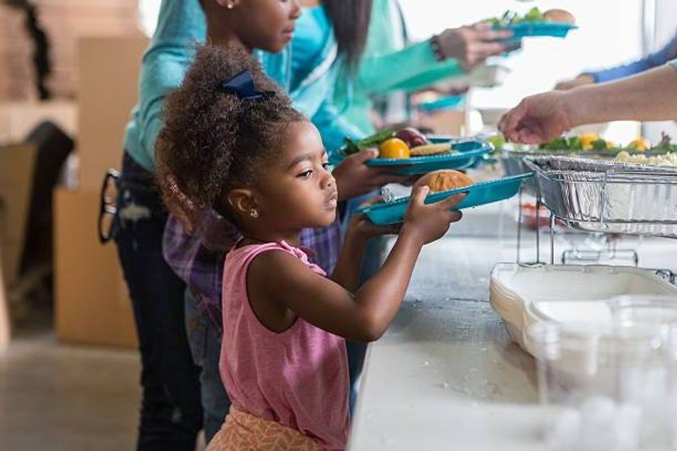 A Child Receives Nutritious Meals Thanks To Weekend Backpacks