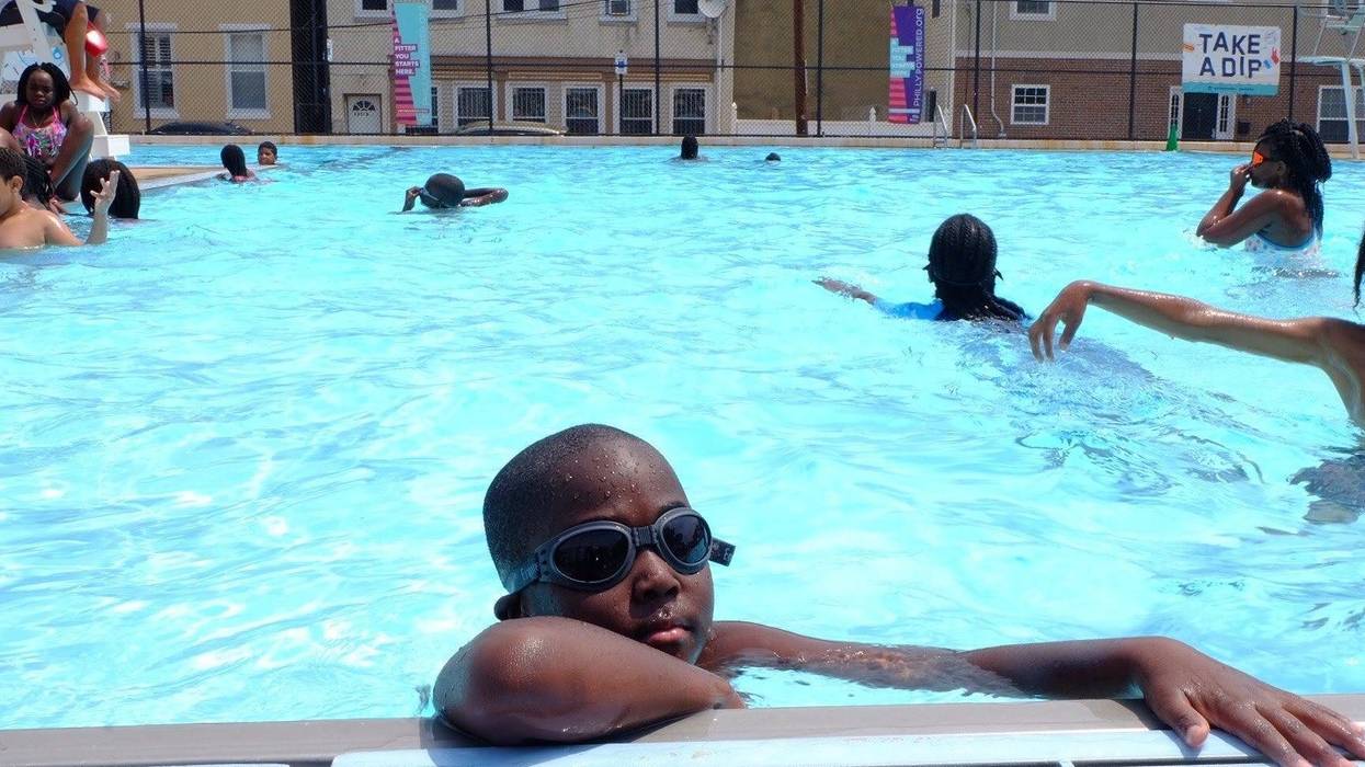 A child swimming in a Philadelphia pool.