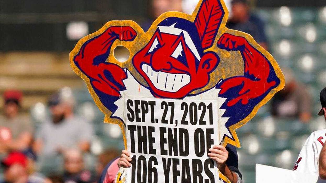 A Cleveland Indians fan holds up a sign