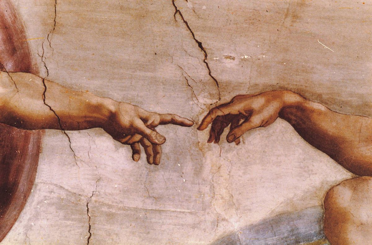A close up of Michelangelo's Sistine Chapel fesco painting "Creation of Adam".