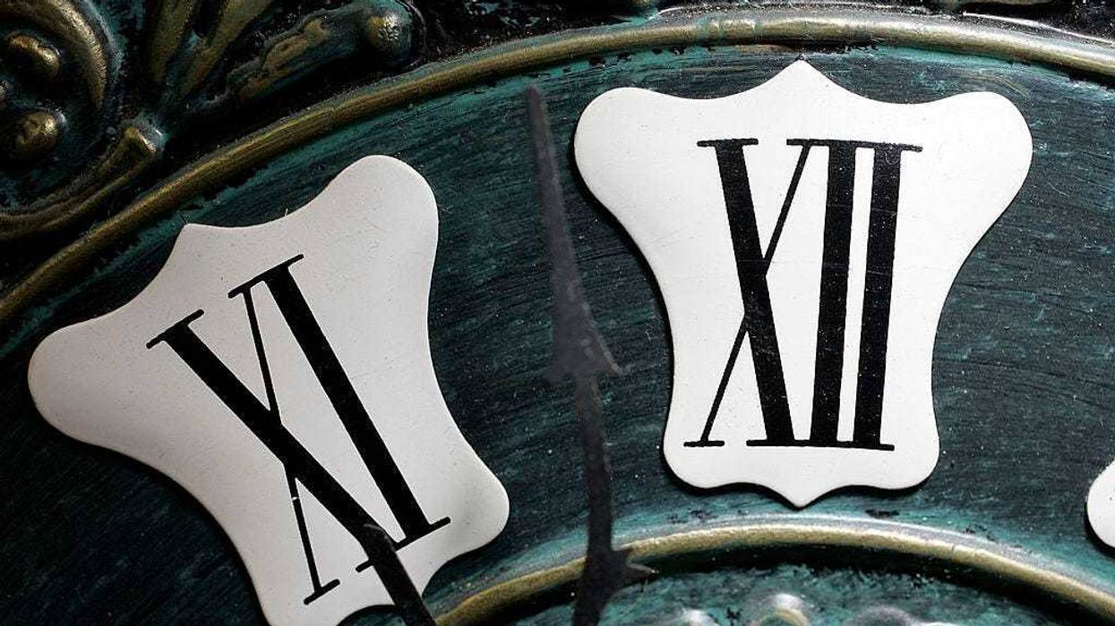 A close up shot of an old clock.