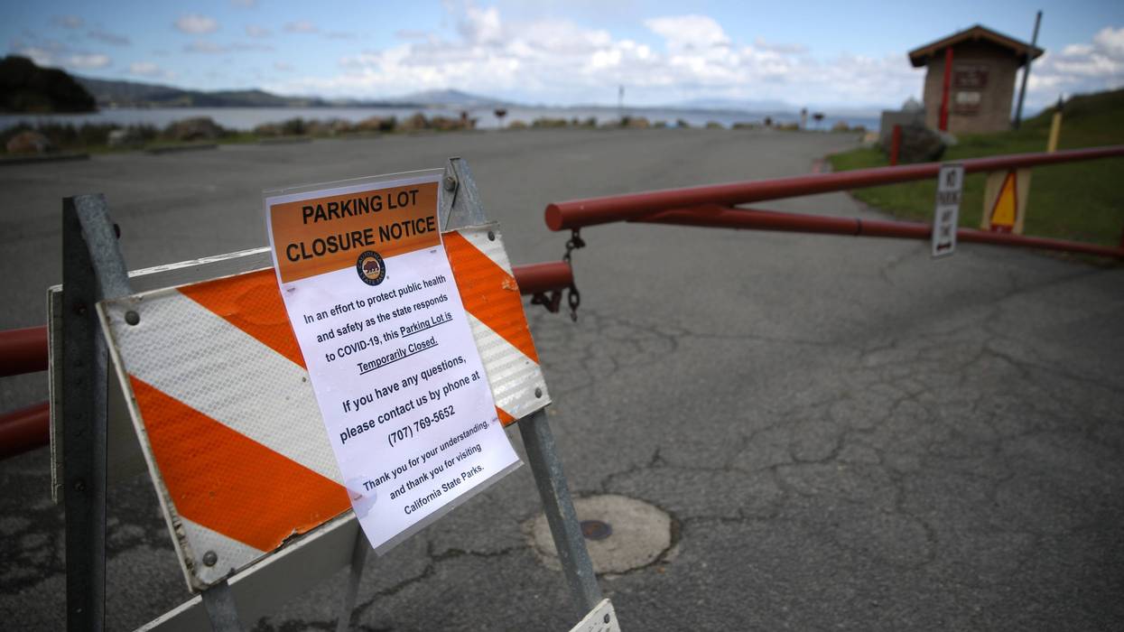 A closed sign is posted in front of a parking lot at China Camp State Park on March 25, 2020 in San Rafael.