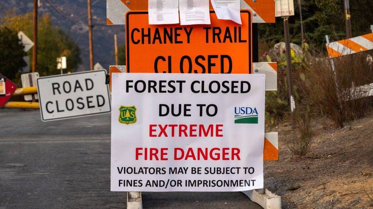 A closure sign is seen as the Angeles National Forest, along with all national forests in California, is closed due to dangerous wildfire conditions on Sept. 1, 2021 in Altadena, California. California and the West are experiencing unprecedented large and destructive wildfires along with record drought as worsening climate change creates extreme weather conditions across the continent, according to climate scientists. California's national forests will remain closed through at least Sept. 17, just as the season for hot, powerful Santa Ana winds in Southern California typically begins, bringing in the most dangerous wildfire weather of the year through early December.