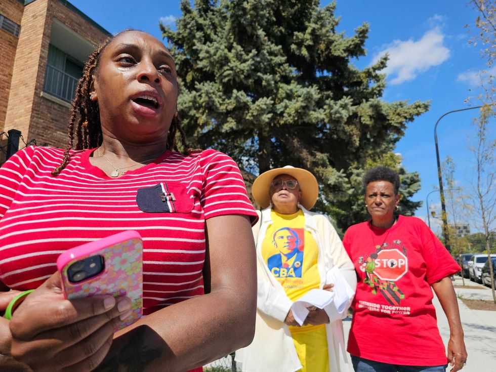 A coalition of Chicagoans from South Shore, Hyde Park and Woodlawn spoke out Thursday about rising housing costs that they say have priced out longtime residents. Here, Stephanie Curry speaks to reporters while Hattie Knazze (center) and Christiana Powell (right) look on.