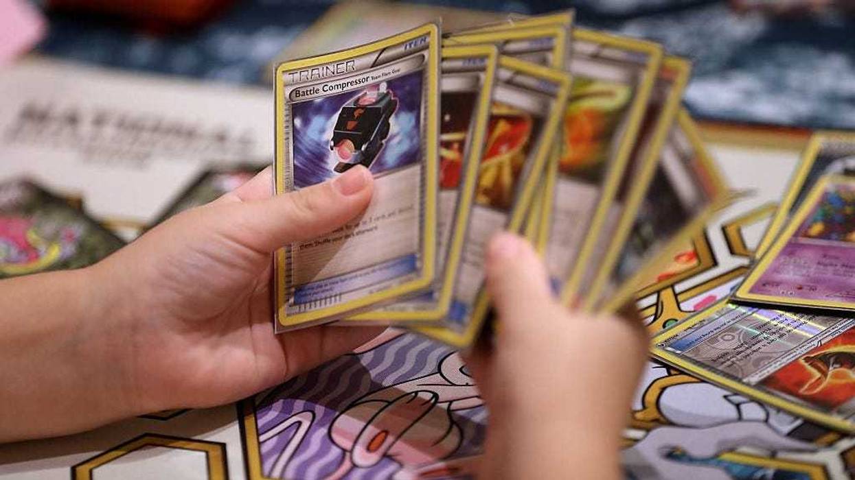 A contestant looks at cards as he competes during the 2016 Pokemon World Championships on August 19, 2016 in San Francisco, California.