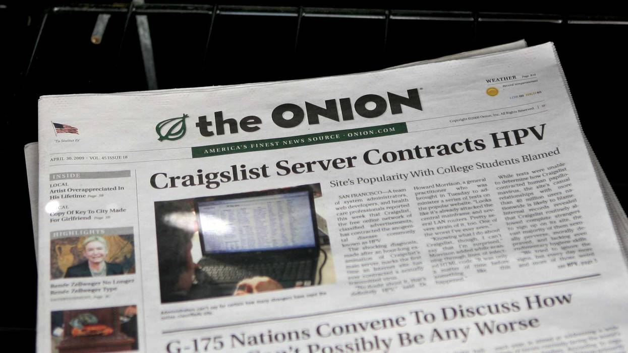 A copy of the Onion is seen in a news rack May 5, 2009, in San Francisco. Earlier this summer, the Onion revived its print publication for the first time in over a decade, and it will distributed on the street during this week's Democratic National Convention in Chicago.