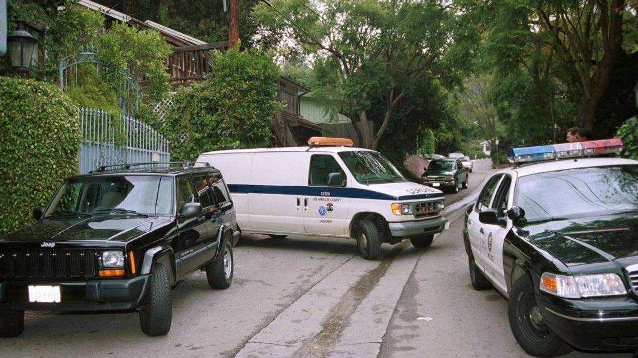 A coroner van arrives at 9701 Yoakum Drive, the scene of a LAPD officer related shooting which resulted in the death of a young costumed Halloween party-goer October 28, 2000 in Bel Air, CA. It is reported that Los Angeles Police Department officers responding to a complaint of a noisy party unable to get an answer at the front door entered the garden of the property and shot dead through a glass door a person who they thought was aiming a gun at the officer. (Photo by Frederick M. Brown/Newsmakers)