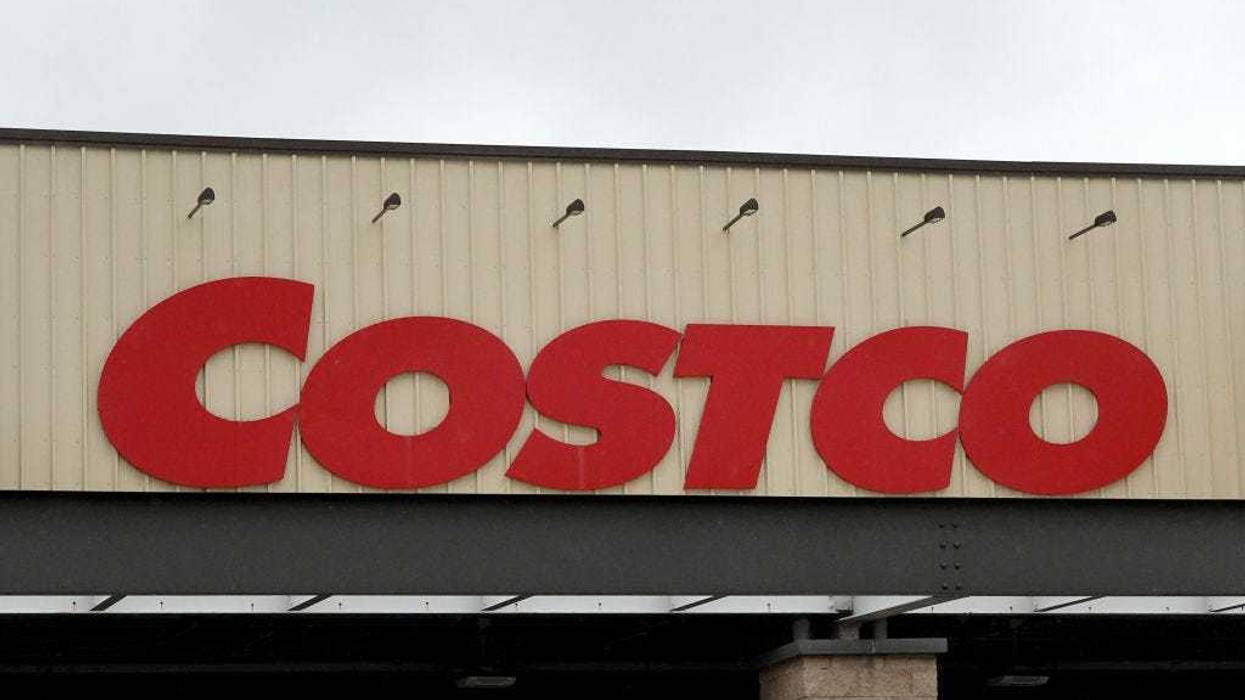 A Costco sign hangs over the entrance to a wholesale store on December 15, 2023 in Miami, Florida.
