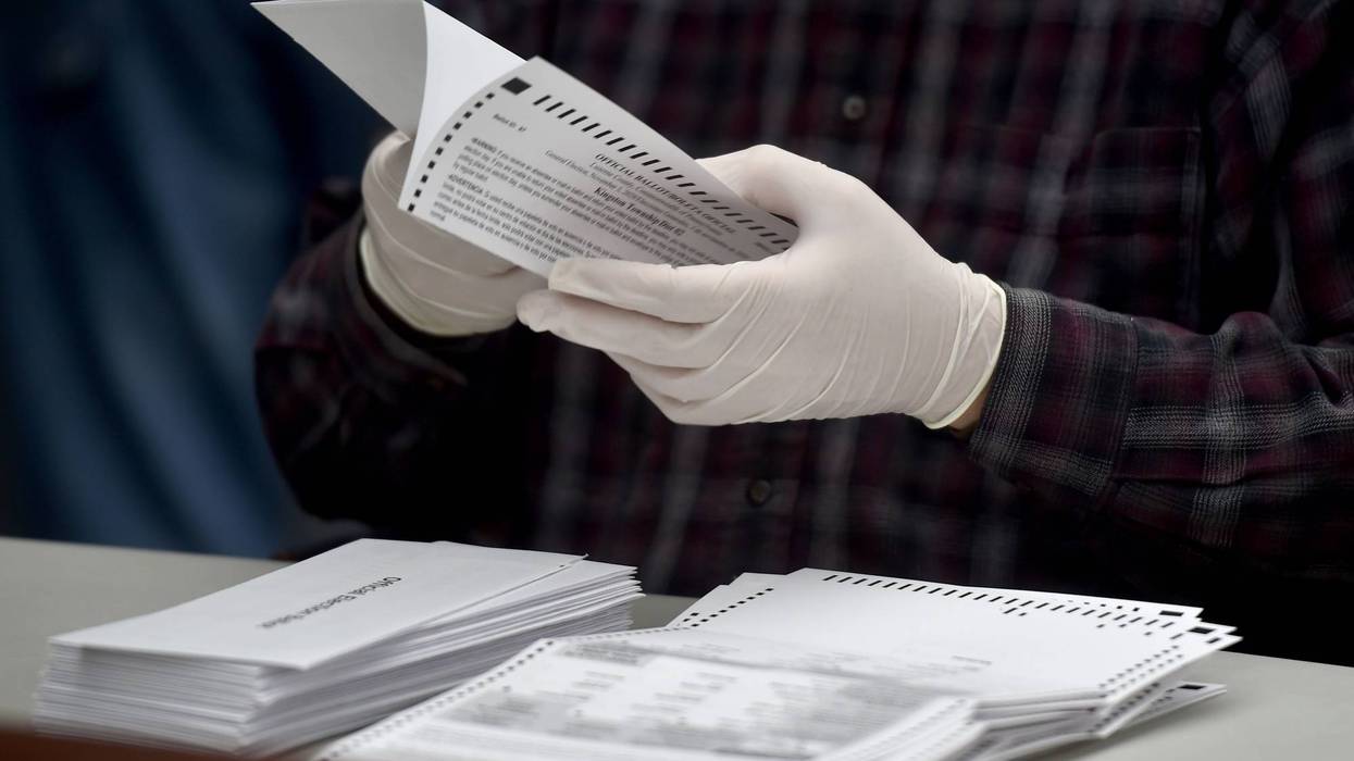 A county employee opens mail-in ballots at the Luzerne County Bureau of Elections.