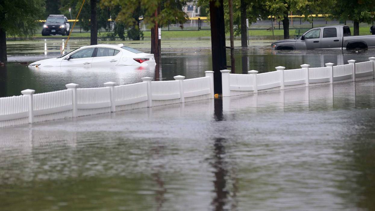 A couple of vehicles stranded in floodwaters at Rogers Park in Danbury, Connecticut, on August 18, 2024