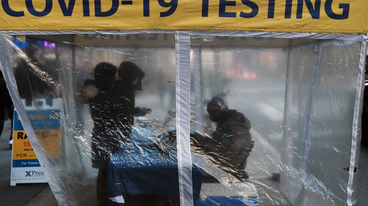 A COVID-19 testing site stands on a sidewalk in Midtown Manhattan on December 09, 2022 in New York City.
