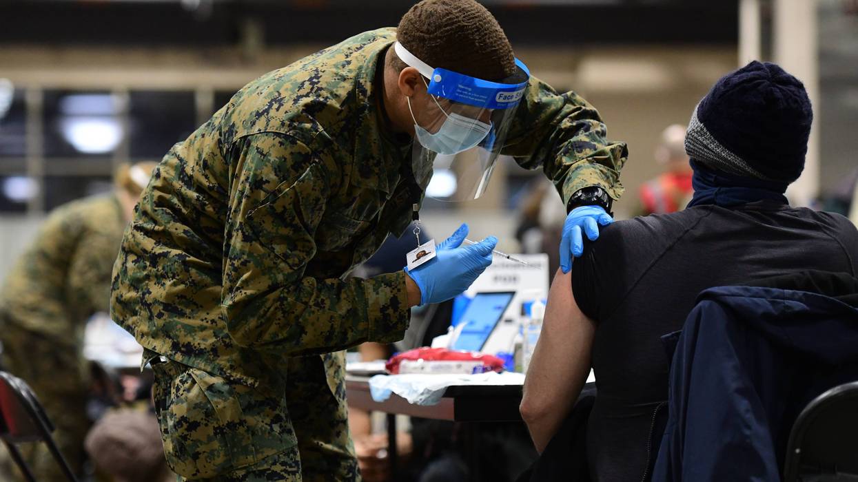 A COVID-19 vaccine being administered at the Pennsylvania Convention Center.