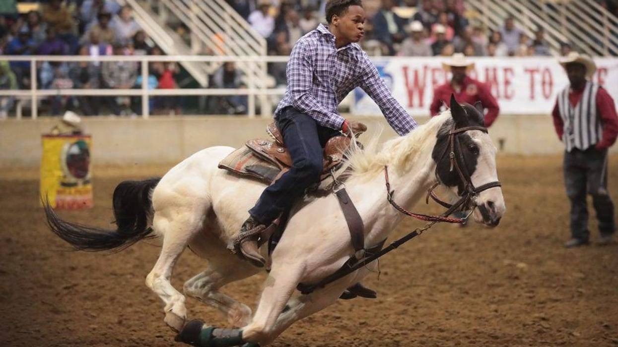 A cowboy participates in the relay race competition at the Bill Pickett Invitational Rodeo on April 1, 2017 in Memphis, Tennessee.