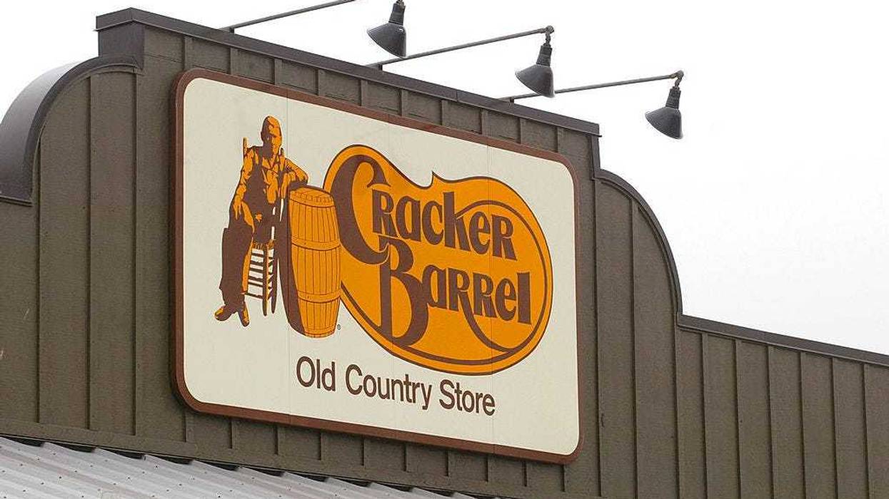 A Cracker Barrel Old Country Store sign is visible atop one of its restaurant stores April 12, 2002.