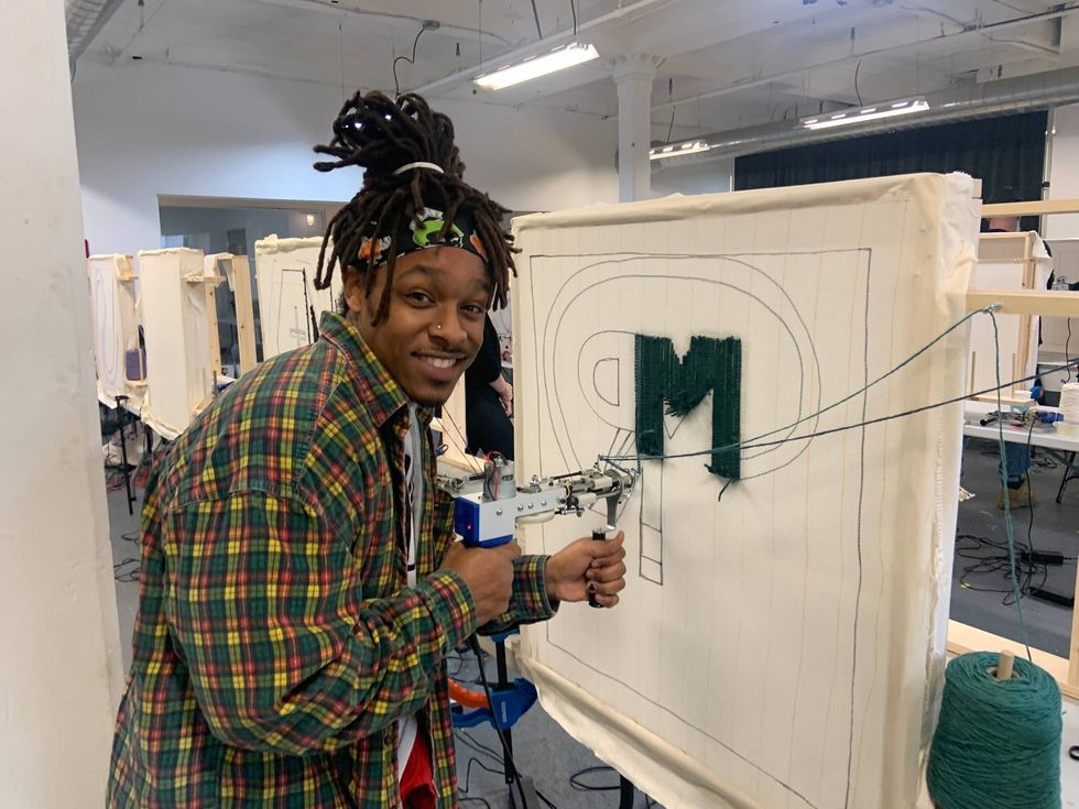 A crafter works on a project at TuftCon.