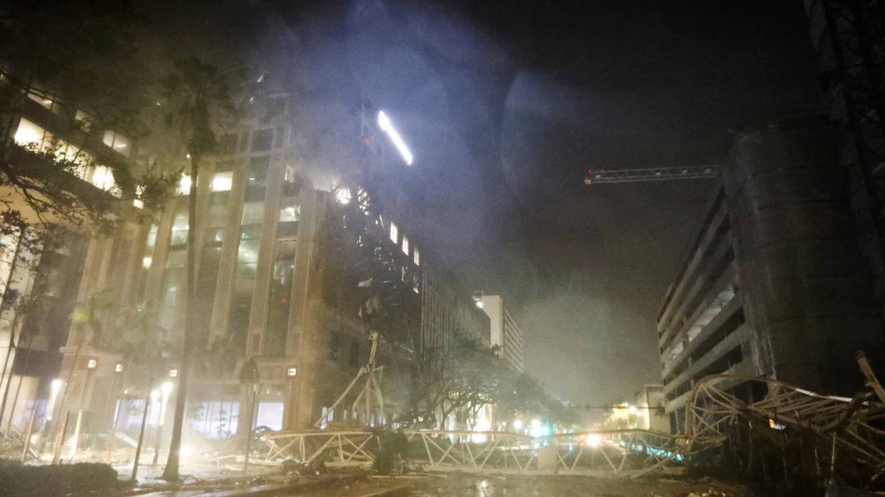 A crane is seen across 1st Avenue South near the Tampa Bay Times offices in St. Petersburg, Florida, Thursday, Oct. 10, 2024, as Hurricane Milton's strong winds tore through the area.