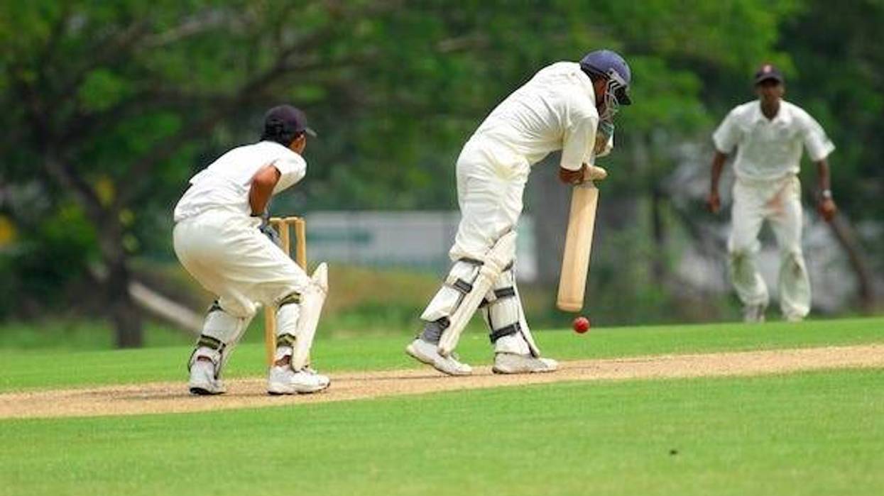 A Cricket batsman and a catcher