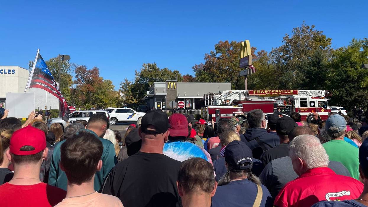 A crowd gathers Sunday outside the McDonald's in Feasterville-Trevose, Pa., where Republican presidential nominee Donald Trump made a campaign stop.