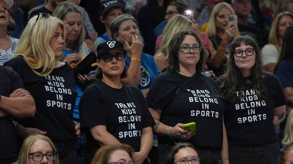 A crowd of supporters and critics of Indiana's Sophie Cunningham and her stance on transgender participation in women’s sports. They gathered at Target Center as the Fever faced the Lynx in Minnesota. Lynx coach Cheryl Reeve wore a shirt under her jacket that said, “Trans kids belong” as she coached on the bench in her team's 108-100 win.