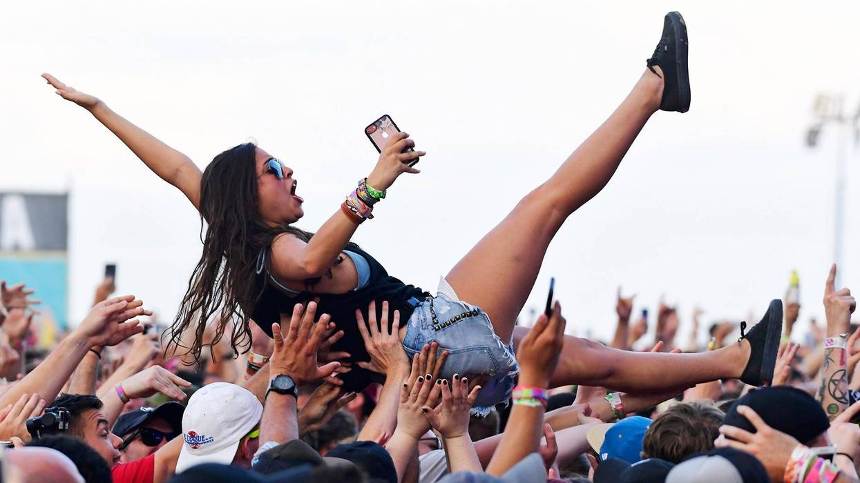 A crowd surfer at Warped Tour