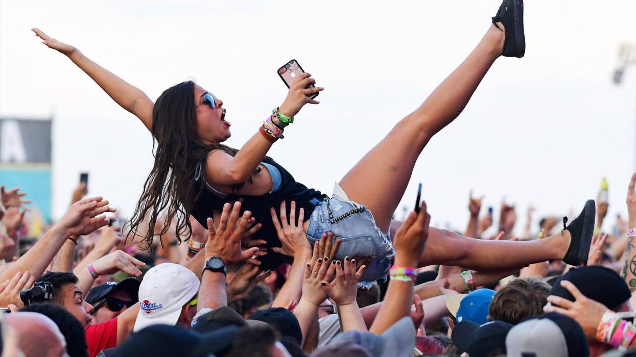 A crowd surfer celebrates Taking Back Sunday's performance during the second and final day of Warped Tour on June 30, 2019 in Atlantic City, New Jersey.