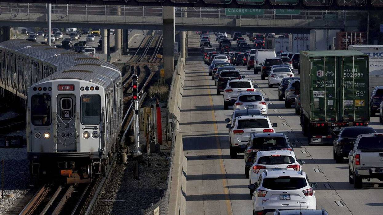 A CTA Red Line train approaches the 95th Street station as heavy traffic travels along the Dan Ryan Expressway toward the Loop on Aug. 30, 2022.