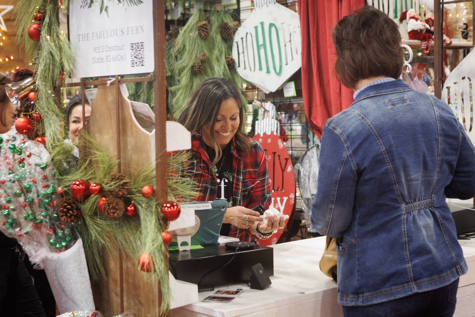 A customer buying a Christmas item at Christmas Connection