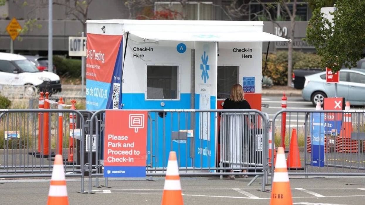 A customer checks in at a Curative COVID-19 test facility at the Larkspur Ferry terminal on May 05, 2022 in Larkspur, California.