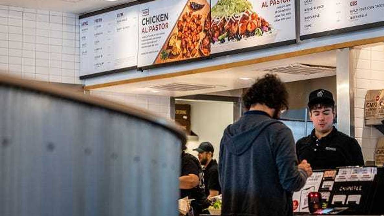 A customer pays for their food at a Chipotle Mexican Grill restaurant on April 26, 2023 in Austin, Texas. Chipotle Mexican Grill posted strong quarterly earnings. Chipotle shares climbed as same-store sales rose 10.9%.