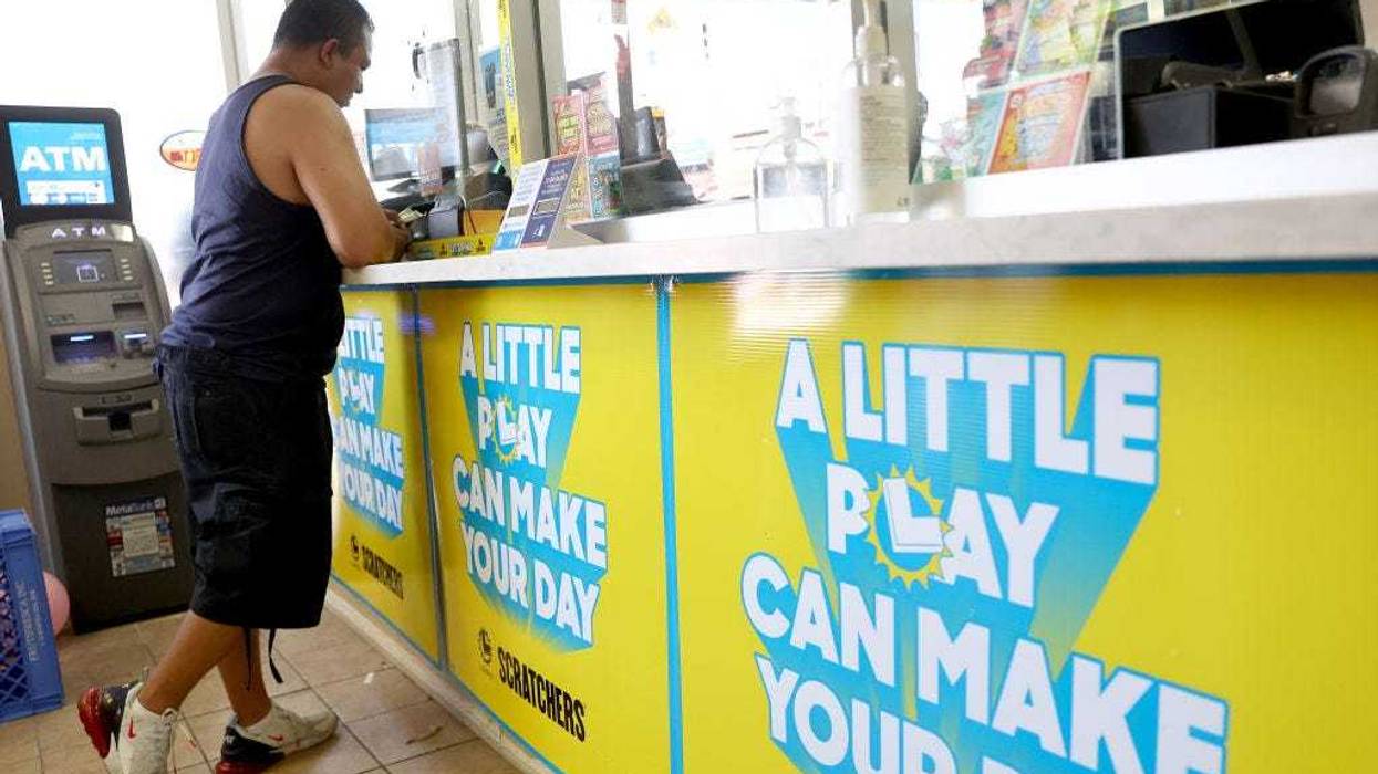 A customer stands in the Las Palmitas Mini Market on July 20, 2023 in Los Angeles California. The $1.08 billion winning Powerball ticket was sold at the Las Palmitas Mini Market for the July 19th drawing. The jackpot is the third largest in Powerball history and was picked after three months of drawings without a winner. The mini market is located in the downtown Fashion District close to Skid Row. (Photo by Mario Tama/Getty Images)