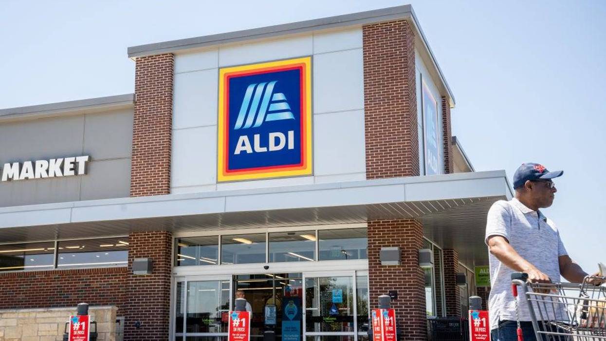 A customer walks out of an Aldi supermarket