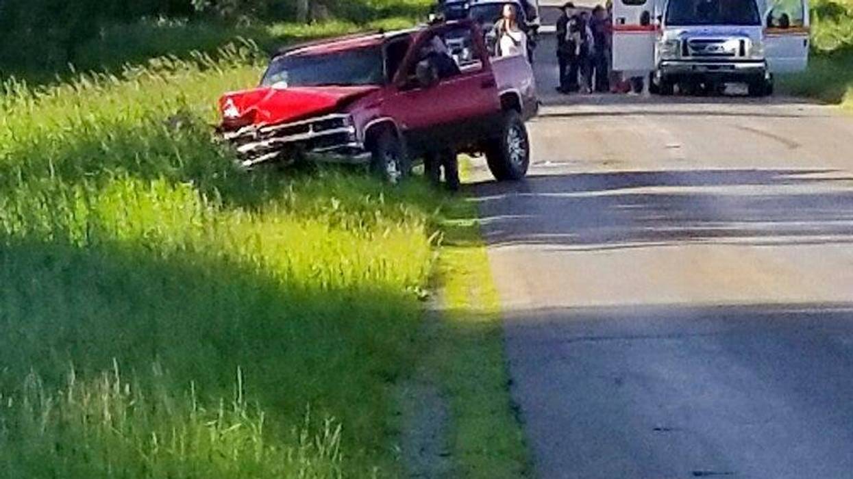 A damaged truck sits on the side of the road after an accident involving a horse-drawn carriage on Friday, June 7, 2019