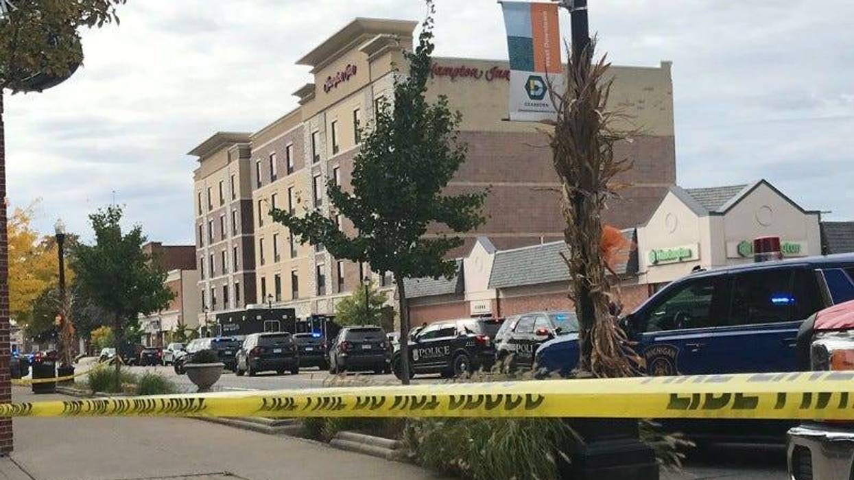 A deadly shooting and hours-long barricaded gunman situation at the Hampton Inn in Dearborn on Thursday did not start over a bill issue, the hotel chain said Friday night.