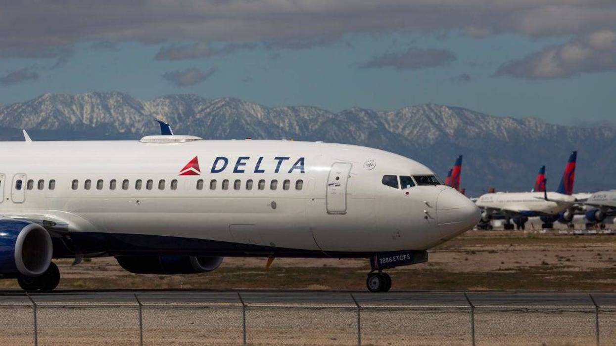 A Delta Air Lines jet taxis to be parked with a growing number of jets at Southern California Logistics Airport (SCLA) on March 24, 2020 in Victorville, California.