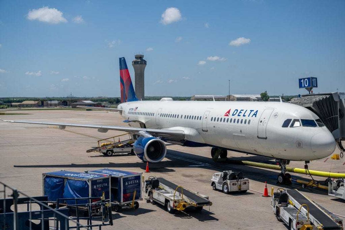 A Delta Air lines plane is seen at its terminal at the Austin-Bergstrom International Airport on April 13, 2023 in Austin, Texas.