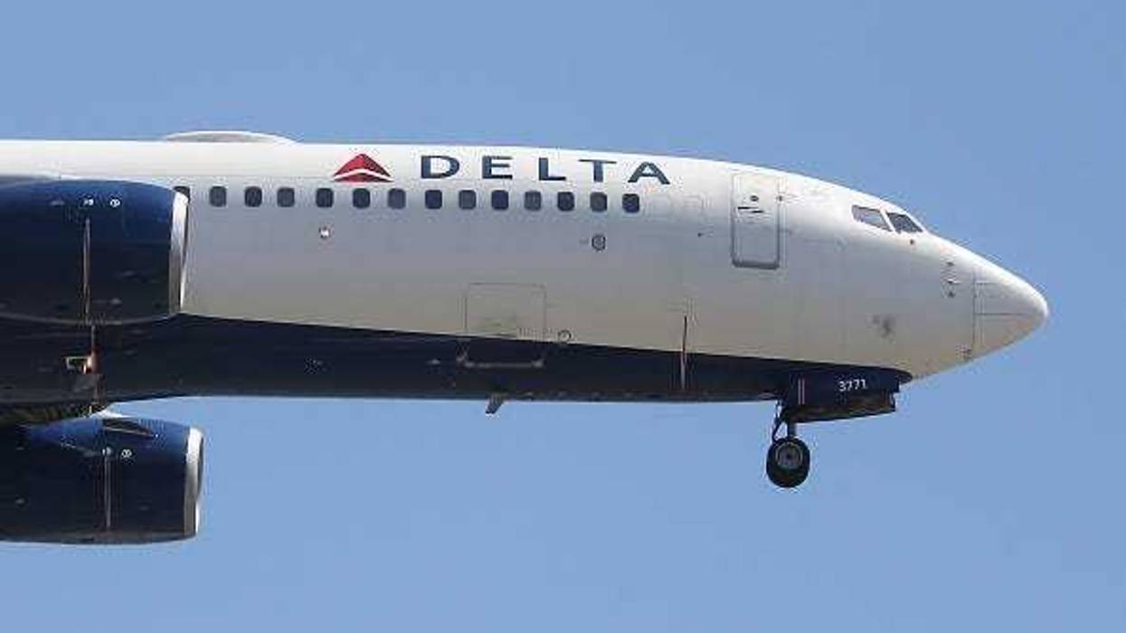 A Delta Air Lines plane lands at Los Angeles International Airport