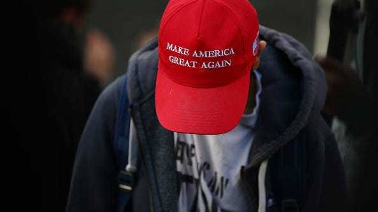 A demonstrator wears a Make America Great Again hat during 'March for Freedom' anti-vaxx protest at Westfield shopping centre in Stratford on December 5, 2020 in London, England. London has been in Tier 2 Covid-19 lockdown restrictions since the nation-wide lockdown ended on December 2.