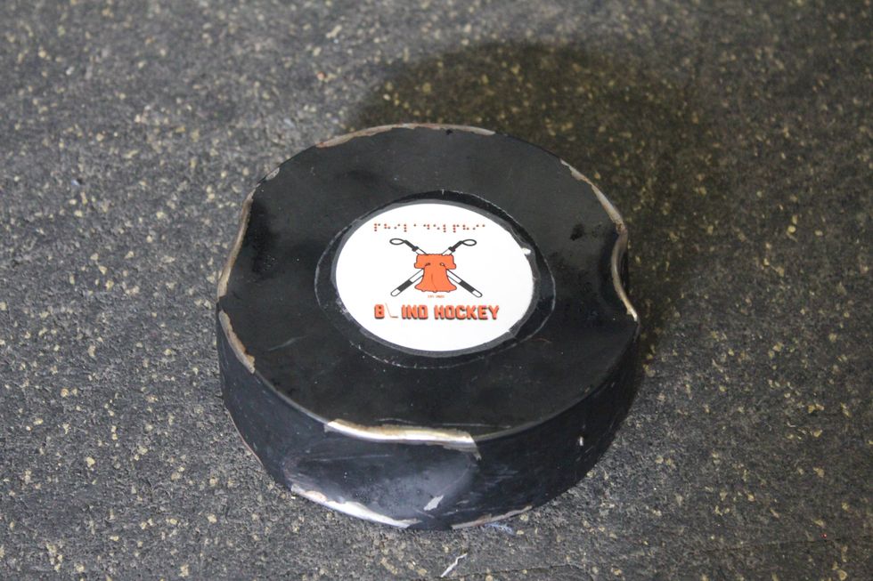 A dented blind hockey puck