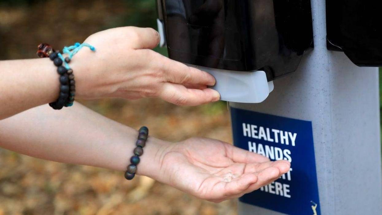 A detail as a fan uses hand sanitizer during a practice round prior to The PLAYERS Championship on The Stadium Course at TPC Sawgrass on March 10, 2020 in Ponte Vedra Beach, Florida.